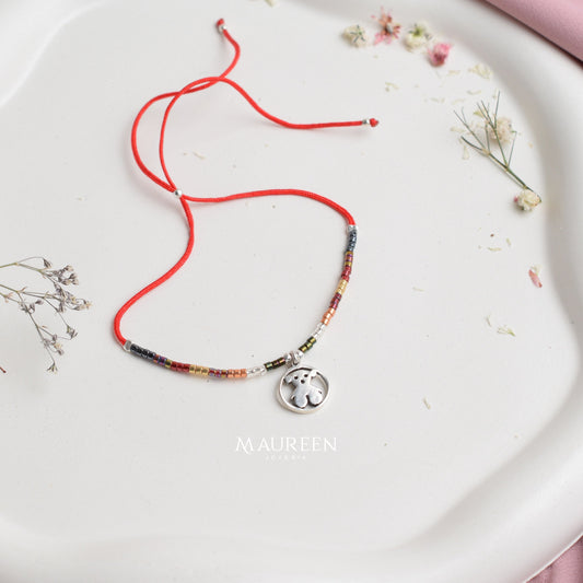 Pulsera miyuqui oso tous hilo negro y rojo - Plata