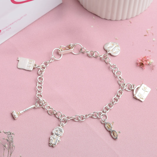 Pulsera con dijes abogada - Plata