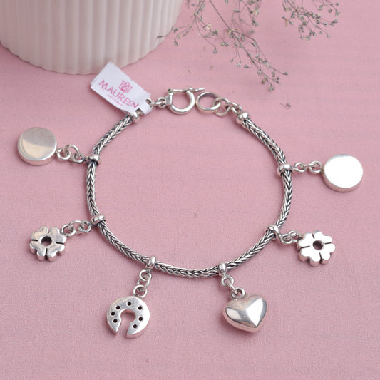 Pulsera dije herraje y flores  - Plata quemada